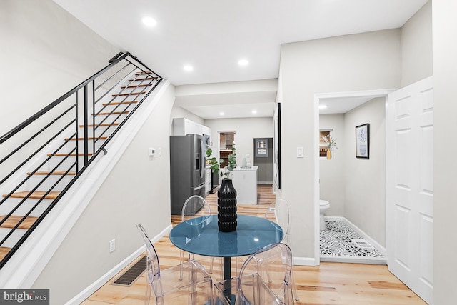 dining space featuring light hardwood / wood-style flooring