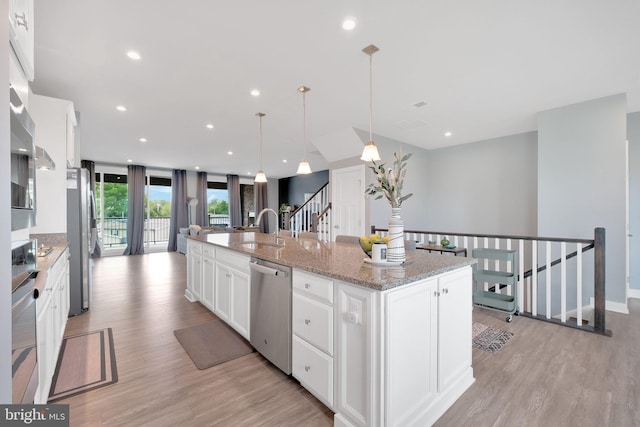 10056 American Pharoah Ln Unit 66, Laurel, MD 20723 - kitchen featuring a sink, appliances with stainless steel finishes, light wood-style flooring, white cabinetry, and recessed lighting