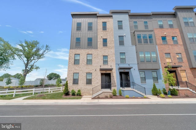 10056 American Pharoah Ln Unit 66, Laurel, MD 20723 - view of building exterior featuring fence