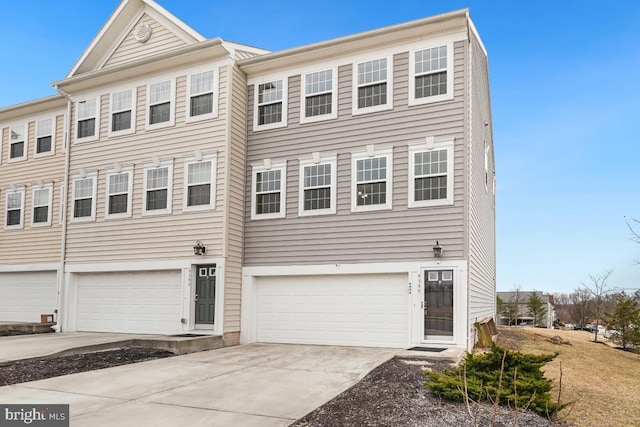 view of property with driveway and an attached garage