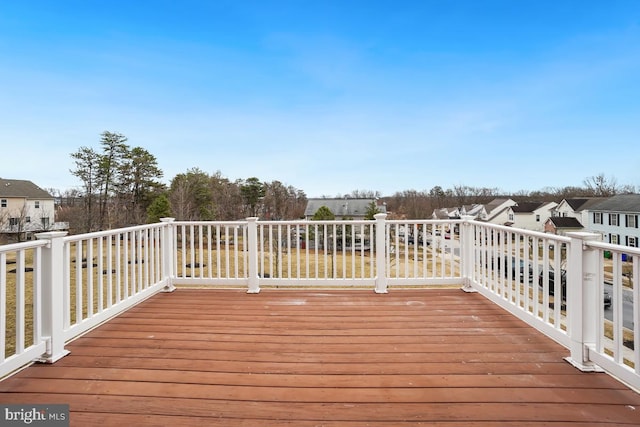 wooden deck with a residential view