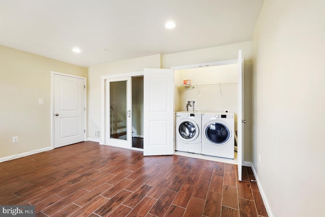 washroom featuring recessed lighting, dark wood-type flooring, washing machine and dryer, laundry area, and baseboards