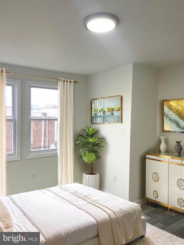 bedroom featuring dark wood-style floors