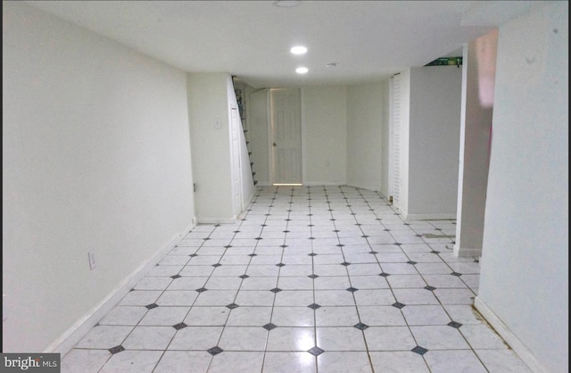 empty room with recessed lighting and baseboards