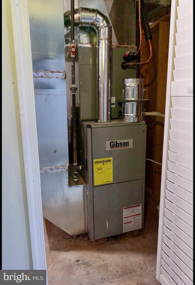 utility room featuring heating unit