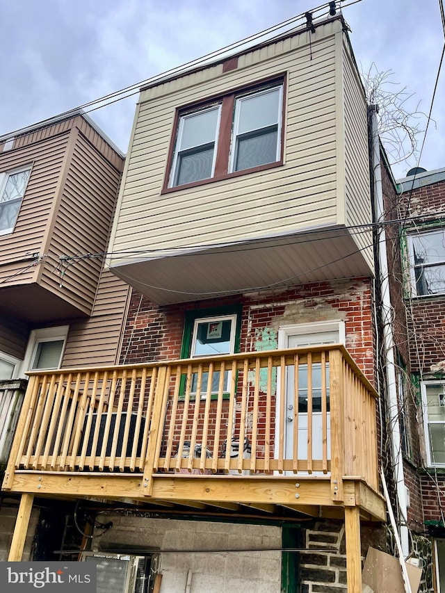 exterior space with brick siding