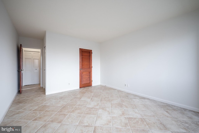 unfurnished bedroom with light tile patterned floors