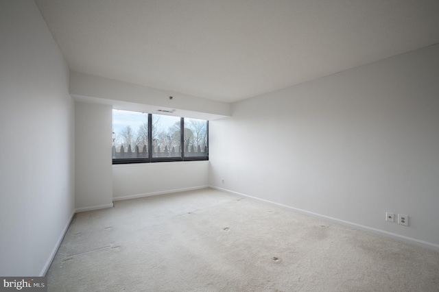 unfurnished room with carpet floors