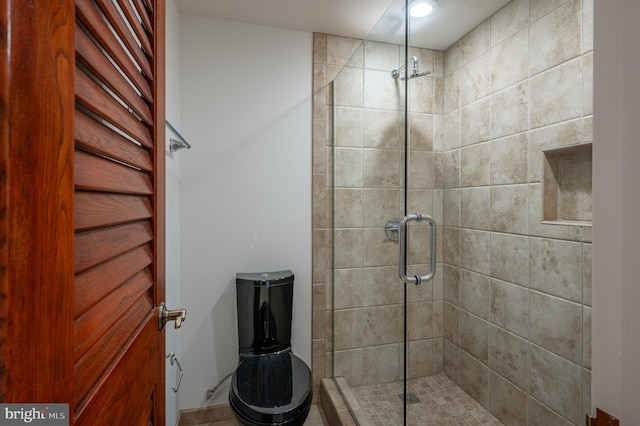 bathroom with a shower with shower door