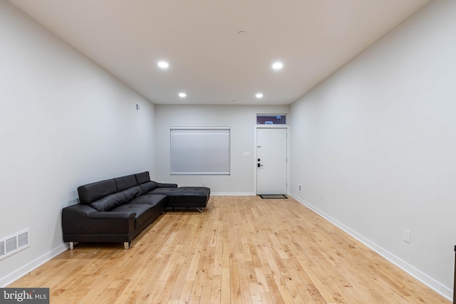 living area with light hardwood / wood-style floors