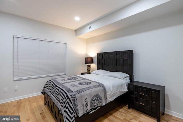 bedroom with light wood-type flooring