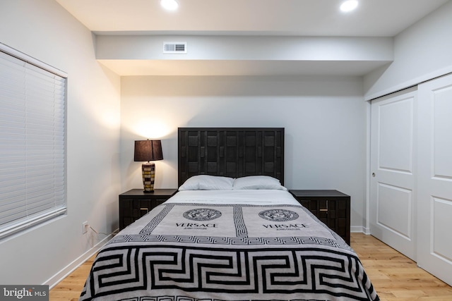 bedroom with a closet and light wood-type flooring