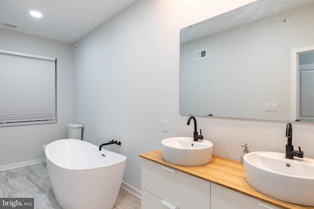 bathroom featuring vanity and a bathtub