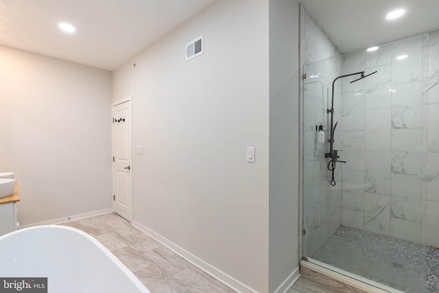 bathroom featuring separate shower and tub