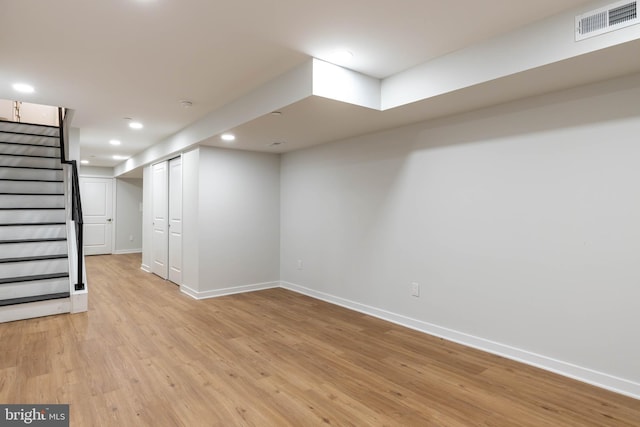 basement featuring light wood-type flooring