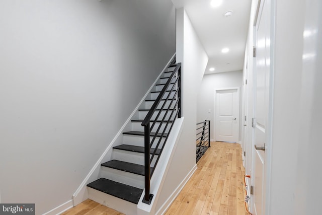 stairway with wood-type flooring