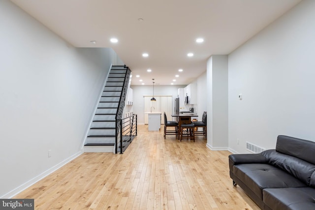 living room featuring light wood-type flooring