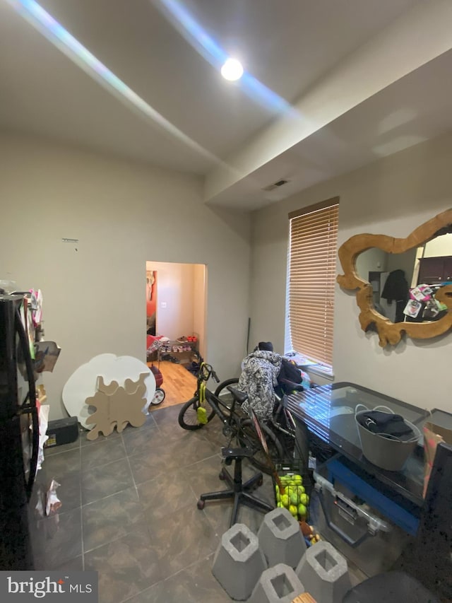 misc room featuring dark tile patterned floors