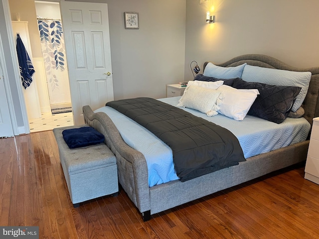 bedroom with hardwood / wood-style floors