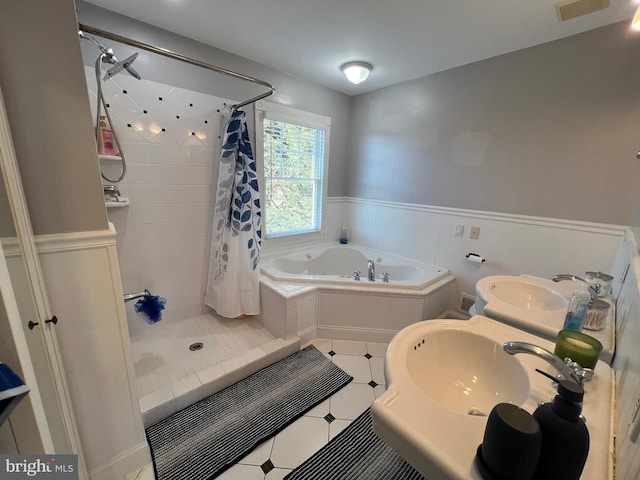 bathroom featuring separate shower and tub and sink