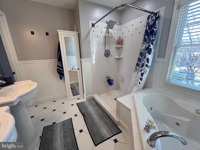 bathroom featuring sink and separate shower and tub