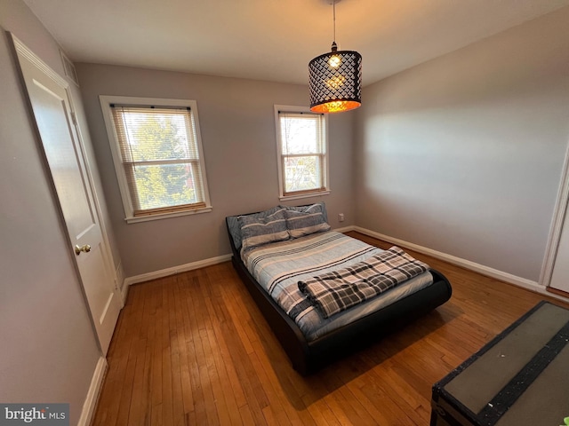 bedroom with hardwood / wood-style floors