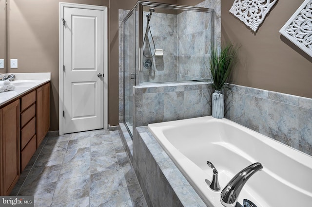 bathroom featuring vanity and separate shower and tub