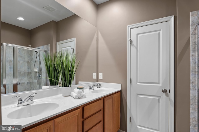 bathroom featuring vanity and walk in shower