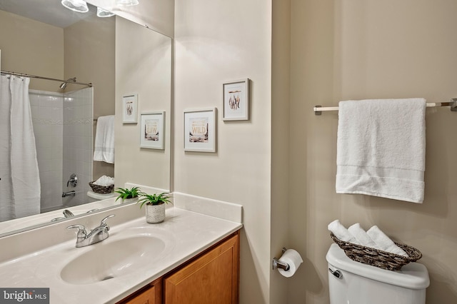 full bathroom featuring vanity, shower / tub combo with curtain, and toilet