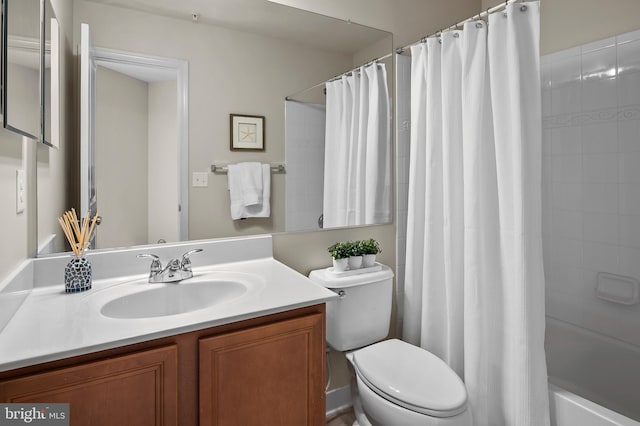 full bathroom featuring vanity, toilet, and shower / bath combo with shower curtain