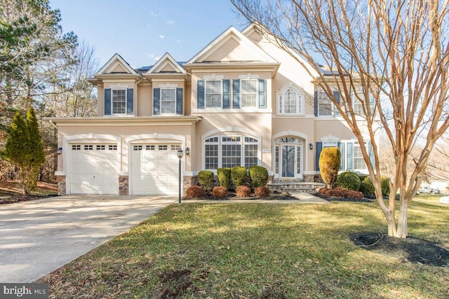 view of front of home with a garage and a front lawn