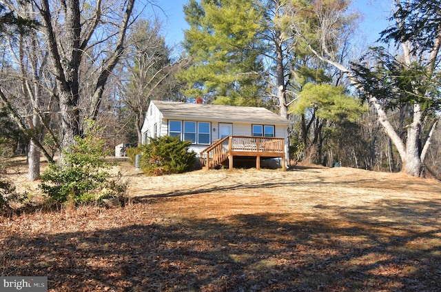 view of front of house featuring a wooden deck