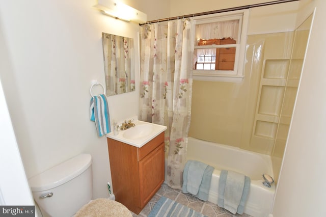 bathroom featuring shower / tub combo, vanity, and toilet