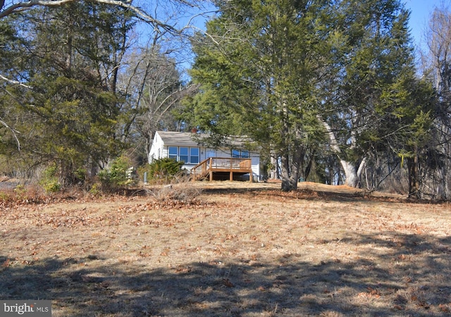 back of house featuring a wooden deck