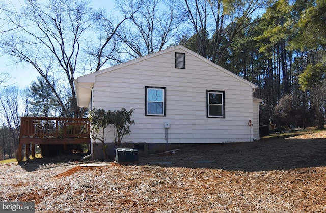 view of side of home featuring a deck