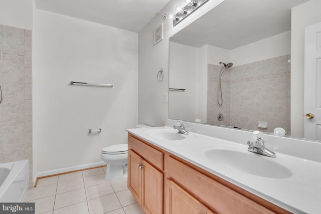 bathroom with tile patterned flooring, double vanity, toilet, and a sink