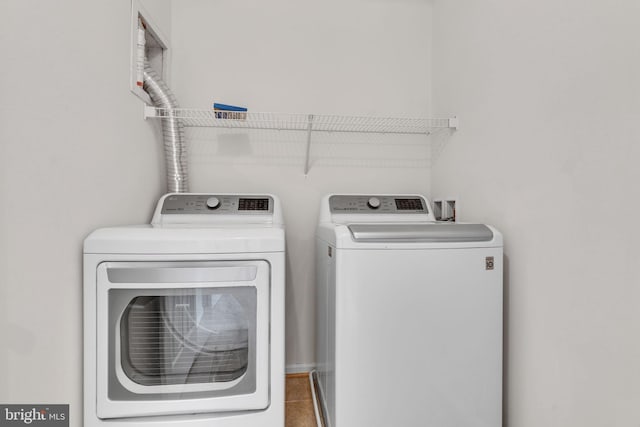 laundry room featuring washer and dryer and laundry area