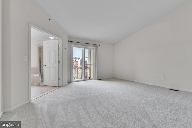 carpeted empty room featuring visible vents and baseboards