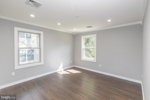 empty room with ornamental molding, baseboards, dark wood finished floors, and recessed lighting