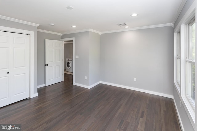 unfurnished bedroom featuring washer / dryer, dark wood-style floors, baseboards, recessed lighting, and ornamental molding