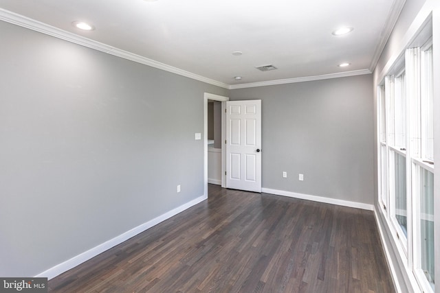 unfurnished bedroom featuring dark wood-style floors, baseboards, ornamental molding, and recessed lighting