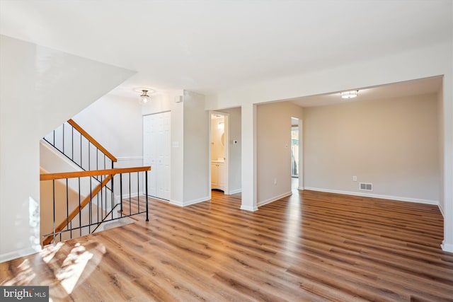 unfurnished room with hardwood / wood-style floors