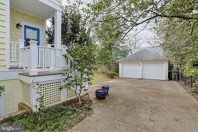 exterior space featuring an outbuilding and a garage