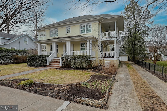 view of front of home with a garage, an outdoor structure, a front lawn, and covered porch