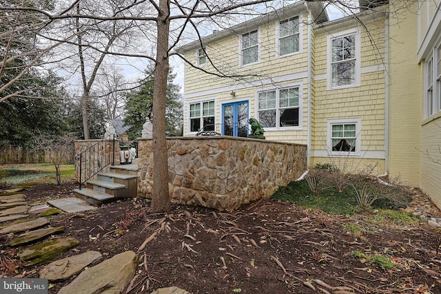 rear view of property with french doors