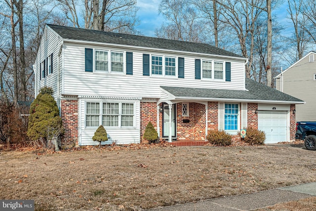 front of property with a garage and a front yard