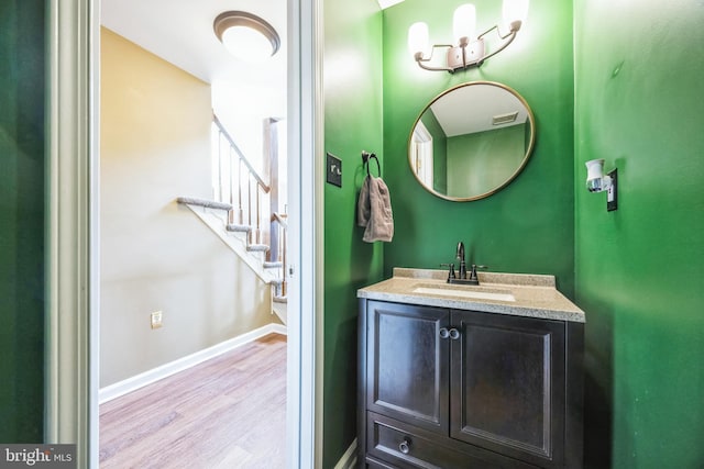 bathroom with vanity and hardwood / wood-style floors