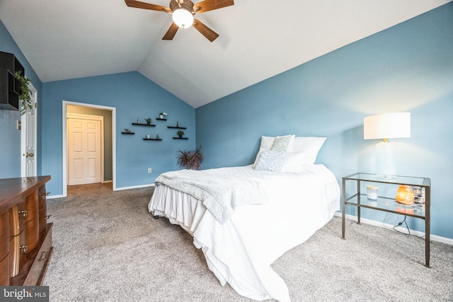 carpeted bedroom featuring lofted ceiling and ceiling fan