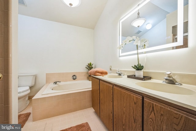 bathroom with tile patterned flooring, vanity, tiled bath, vaulted ceiling, and toilet