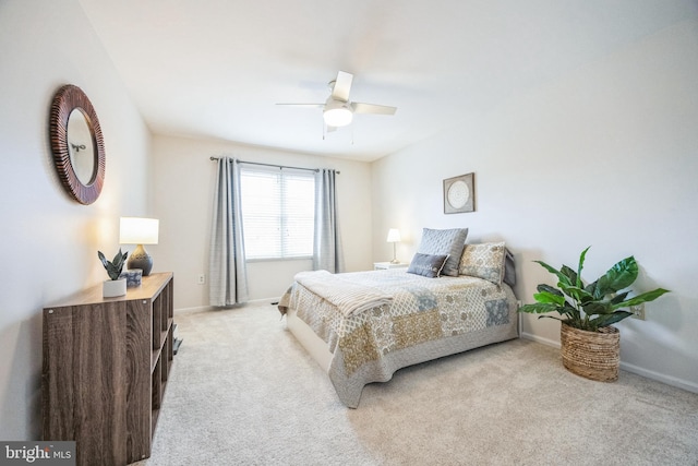 bedroom with ceiling fan and light colored carpet